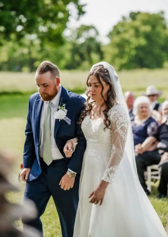 Bride and groom walking recessional outdoor ceremony Oklahoma wedding