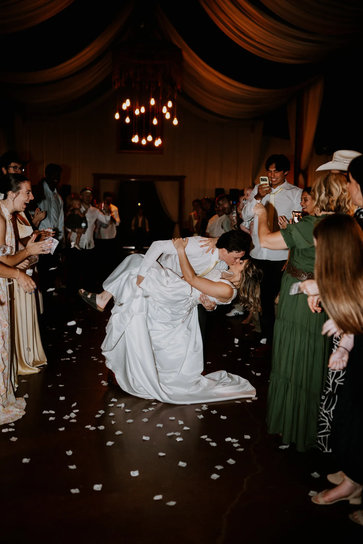 Bride and groom dip kiss on reception dance floor Oklahoma wedding photography
