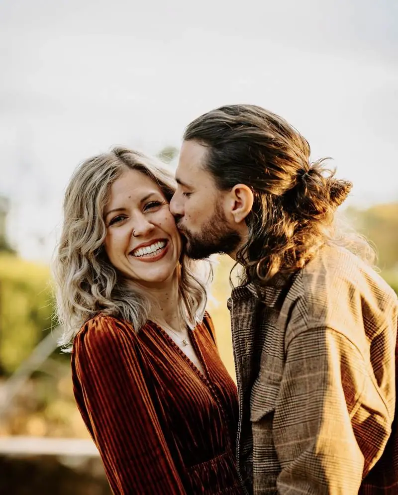 Couple kissing cheek fall colors mini session Oklahoma