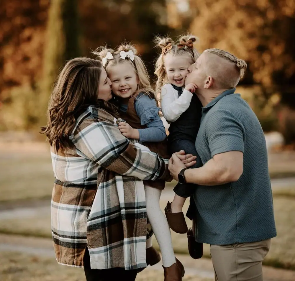 Family kissing daughters fall mini session Oklahoma City