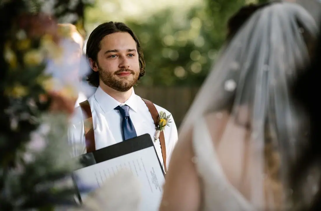 Groom watching bride walk down aisle ceremony outdoor wedding Oklahoma