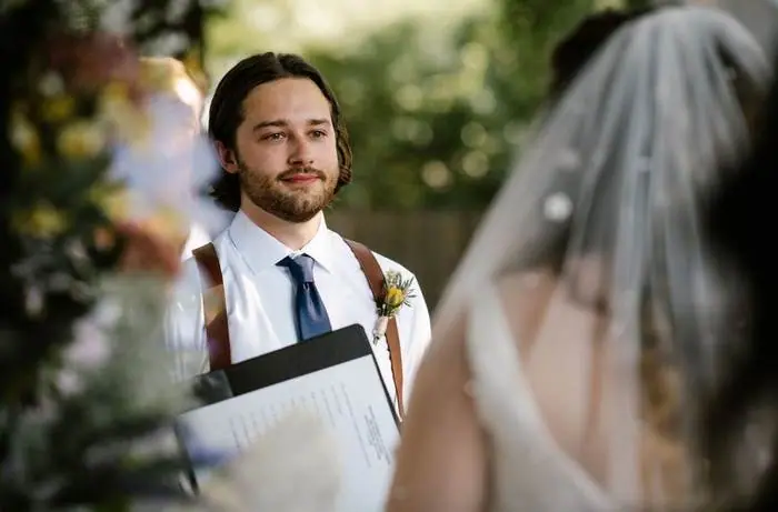 Groom watching bride walk down aisle ceremony outdoor wedding Oklahoma