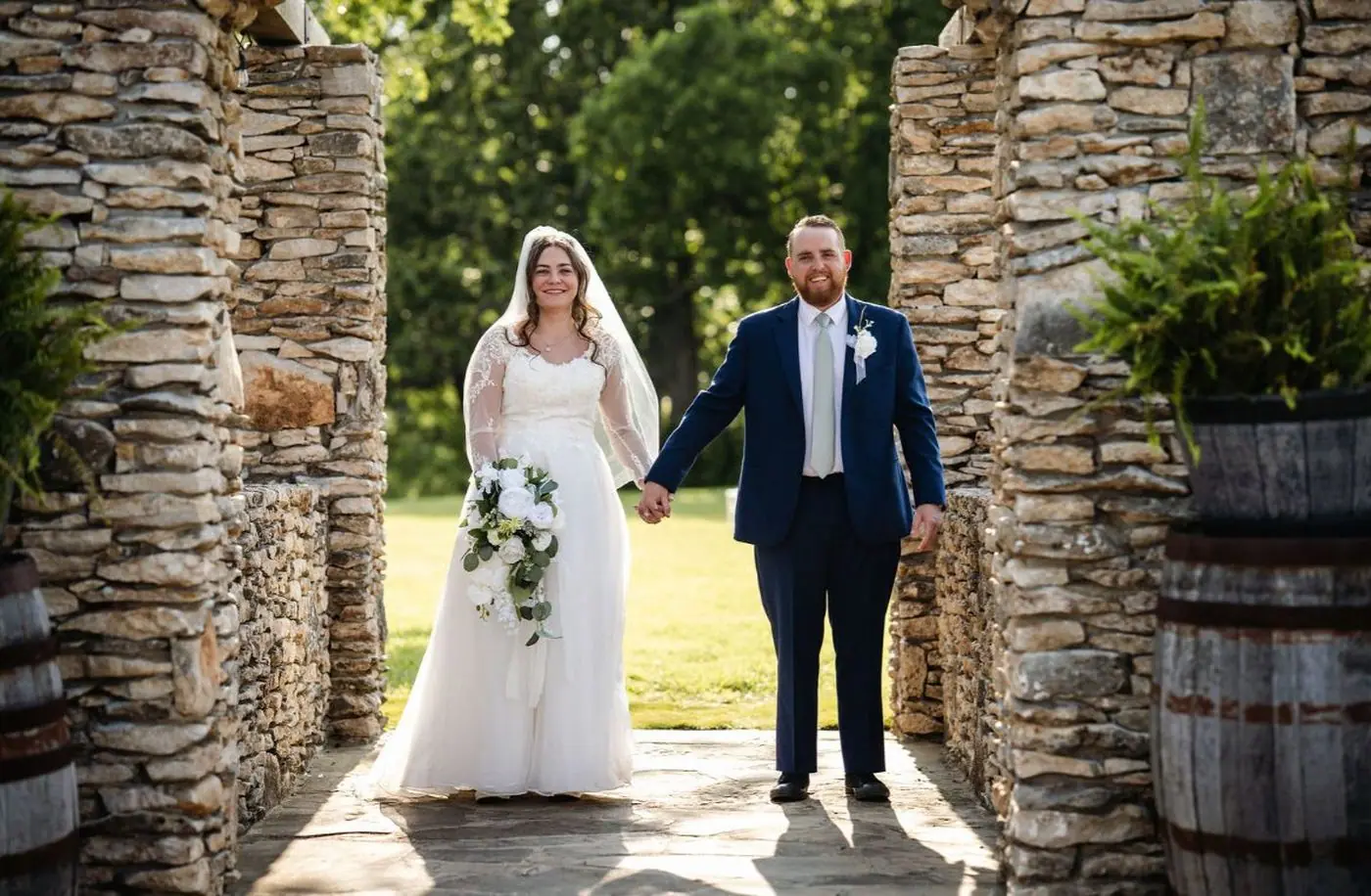 Bride and groom portrait stone archway Oklahoma wedding Chris Macee Photography