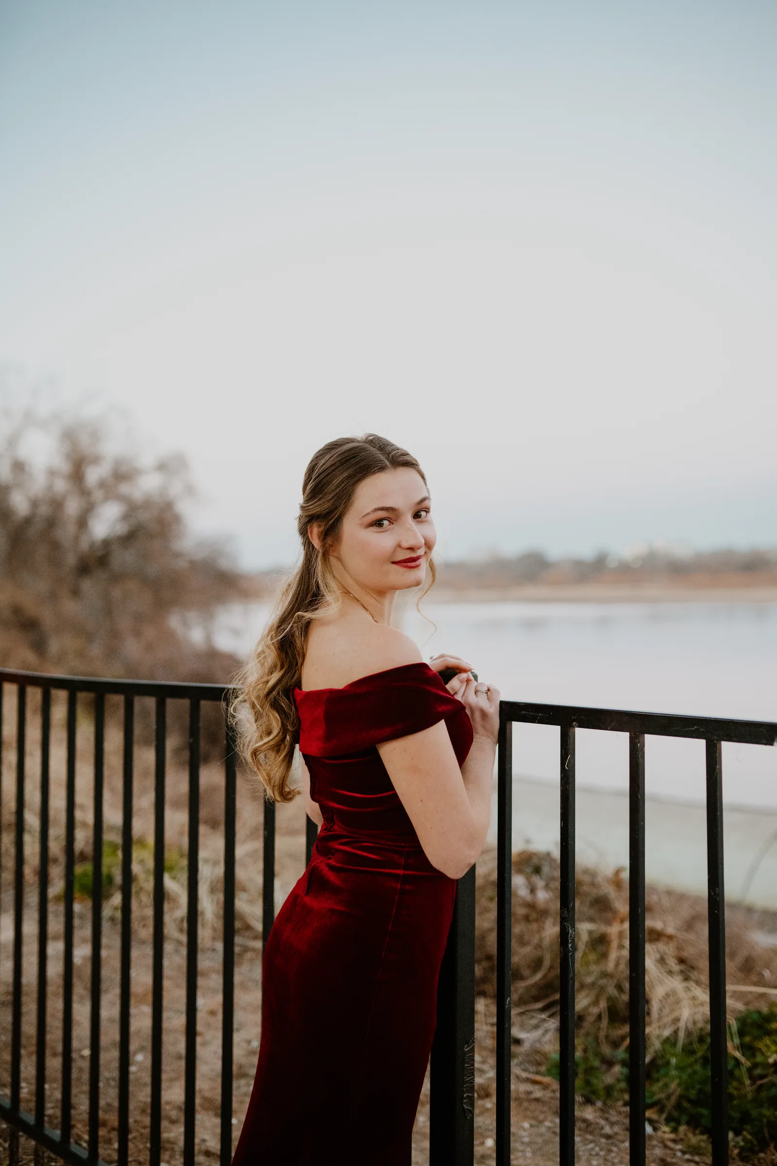 Woman in red dress lakeside portrait Oklahoma