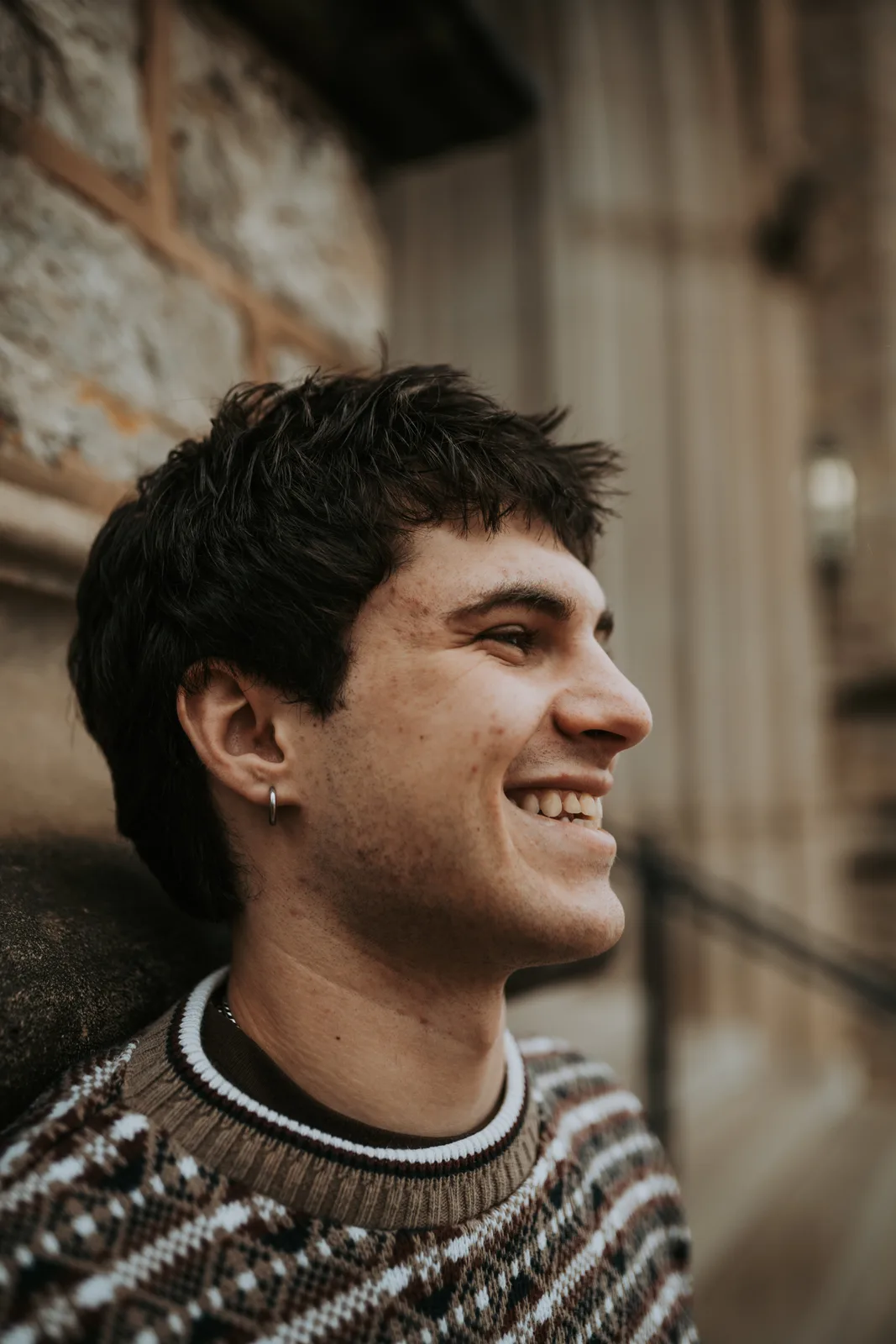 Senior guy smiling stone steps portrait Tulsa senior pictures