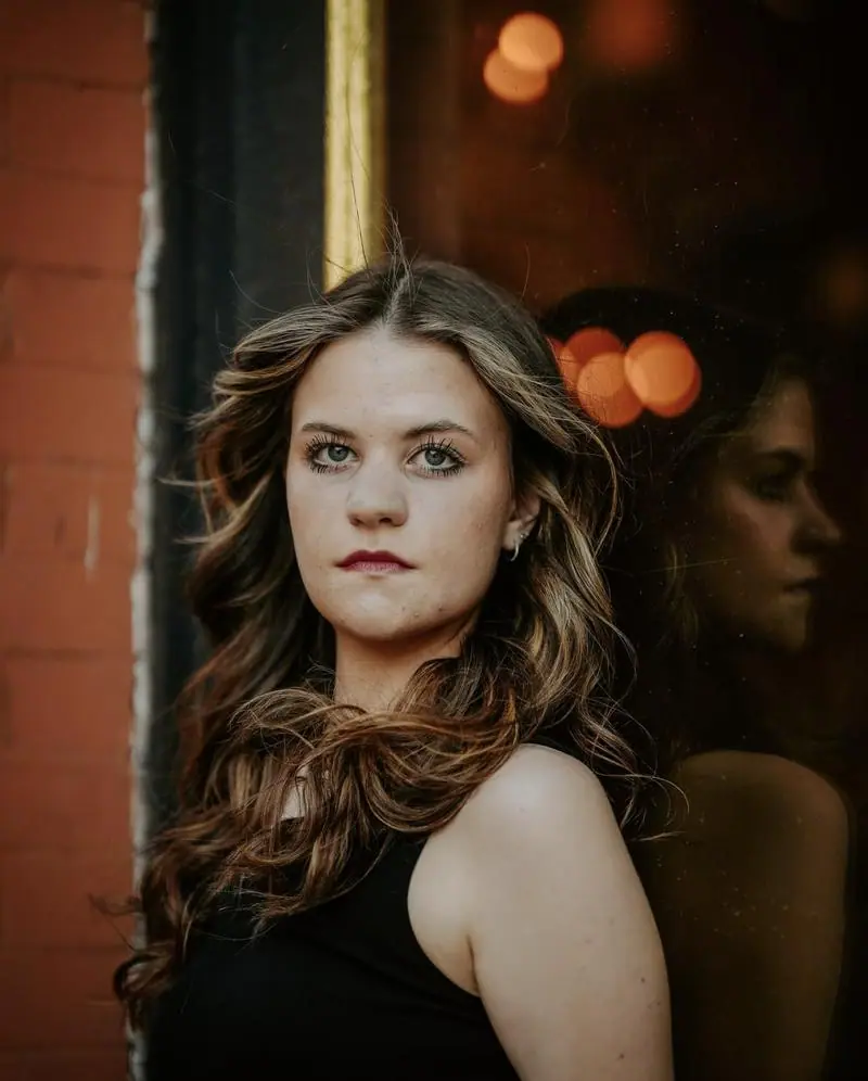 Senior portrait girl downtown window reflection Tulsa Oklahoma photographer